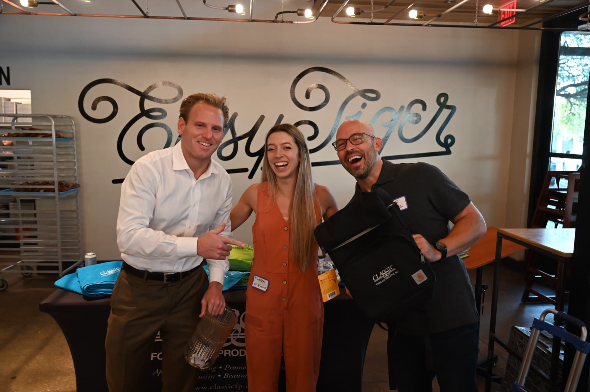 Marketers laughing together at Easy Tiger during a Marketing Morning