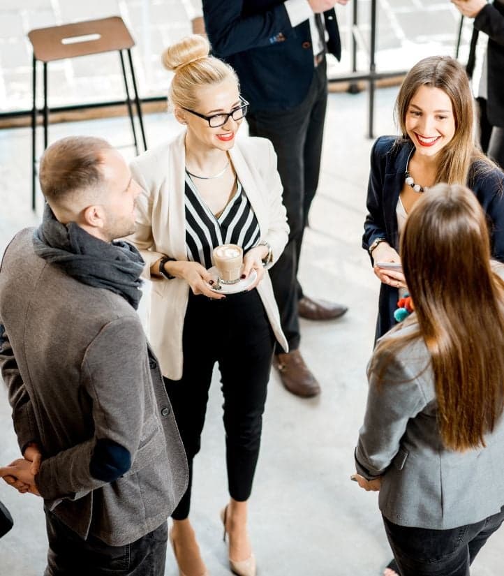 Professionals networking over coffee
